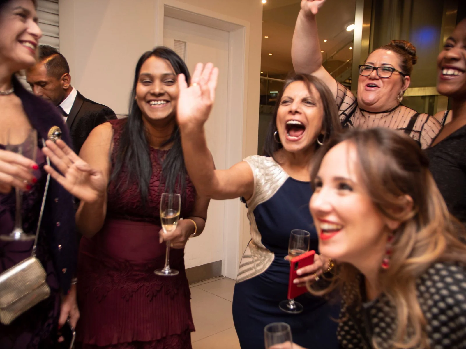 Corporate guests reacting to close-up magic