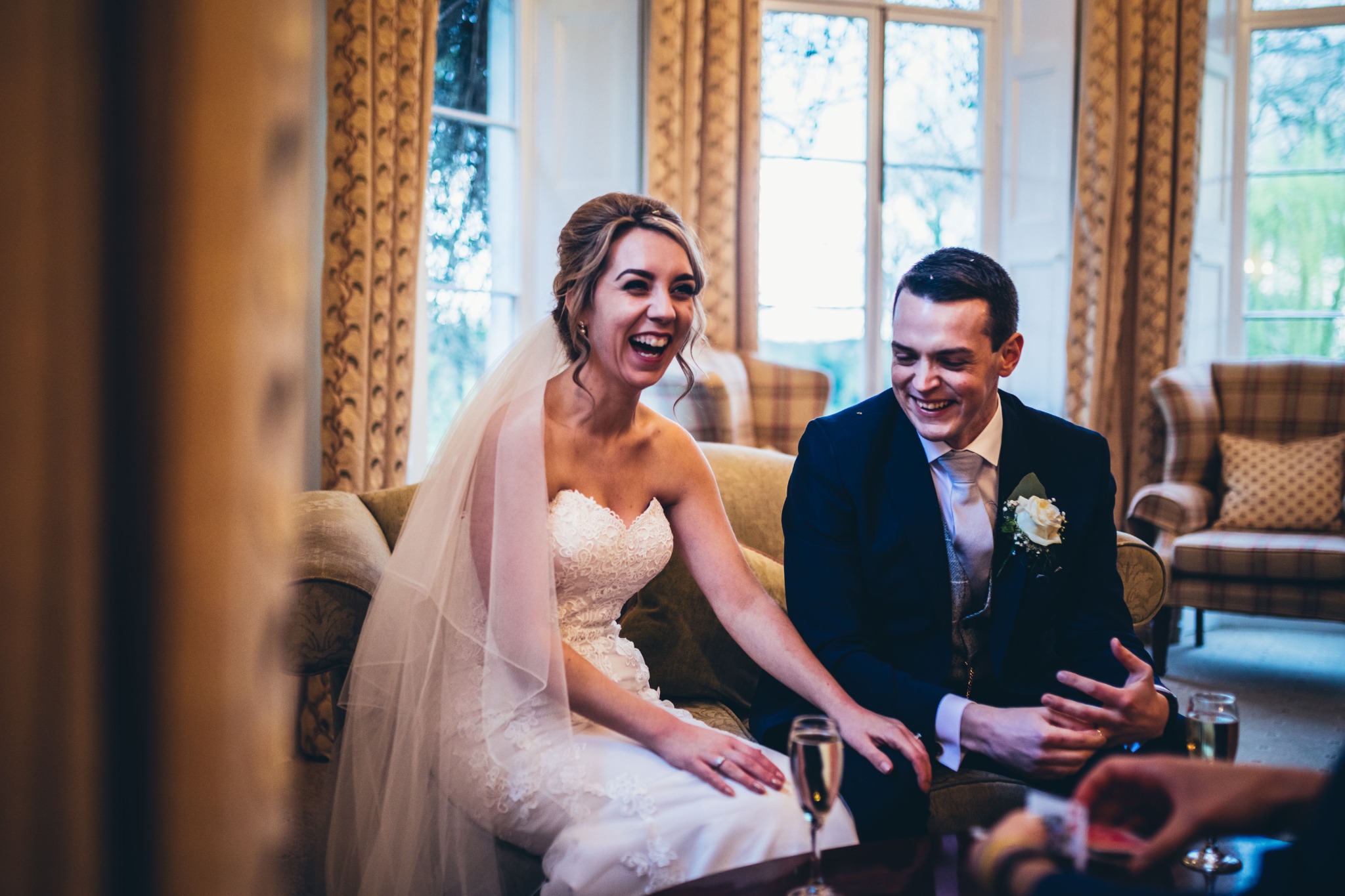 Bride and groom reacting to close-up magic at a wedding