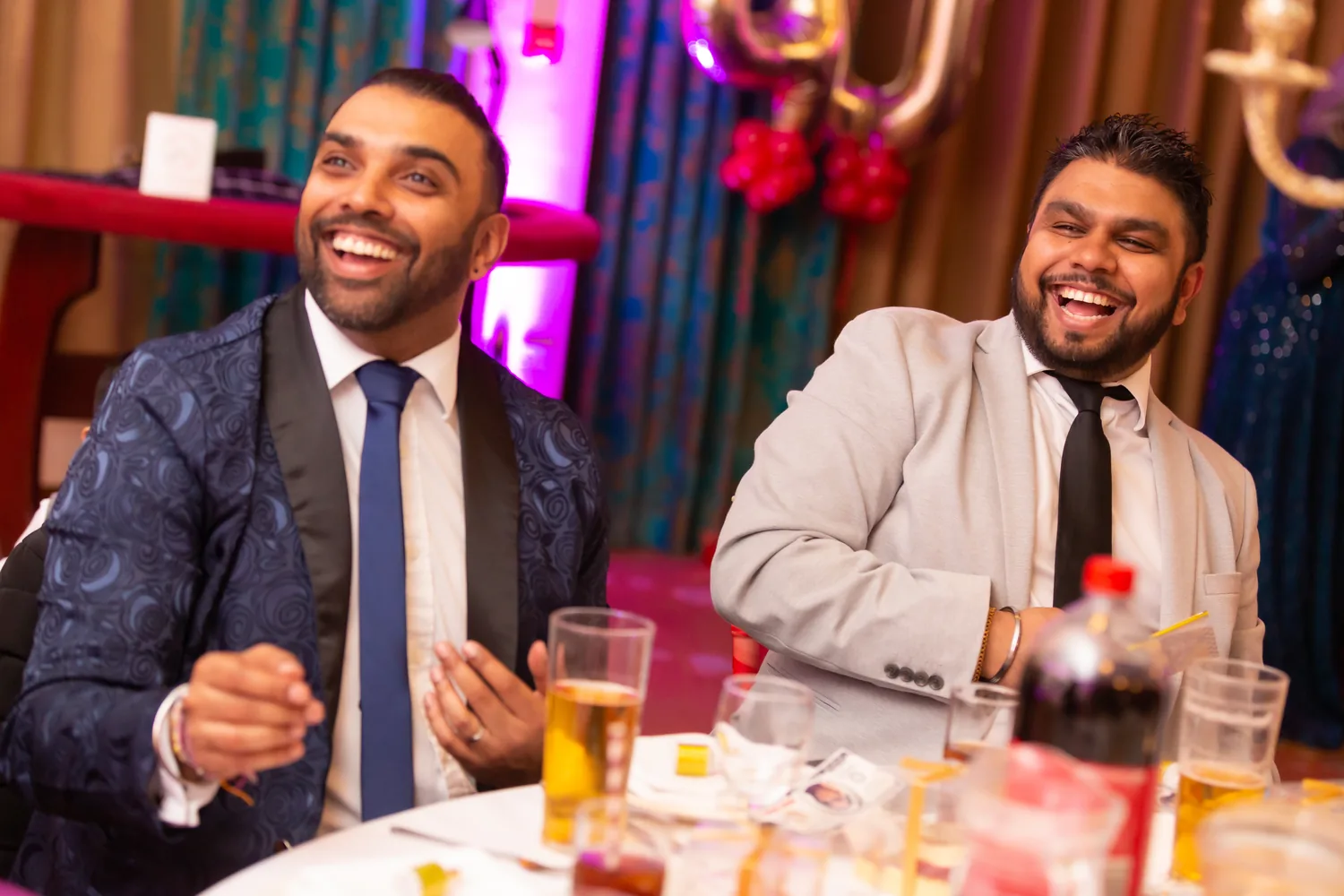 Guests laughing during close-up magic
